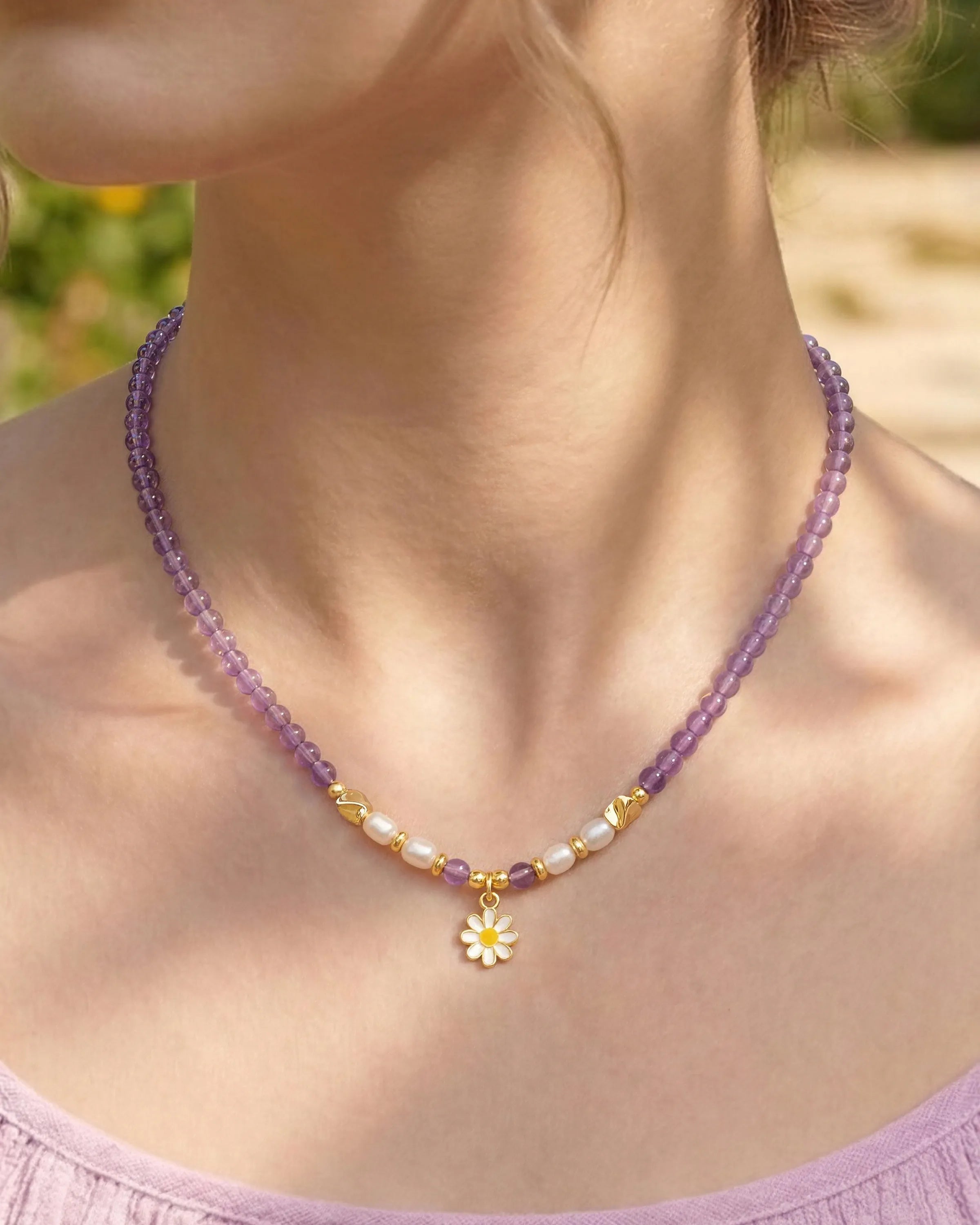 Close-up of Amethyst Red Agate Gold Daisy Necklace on neck