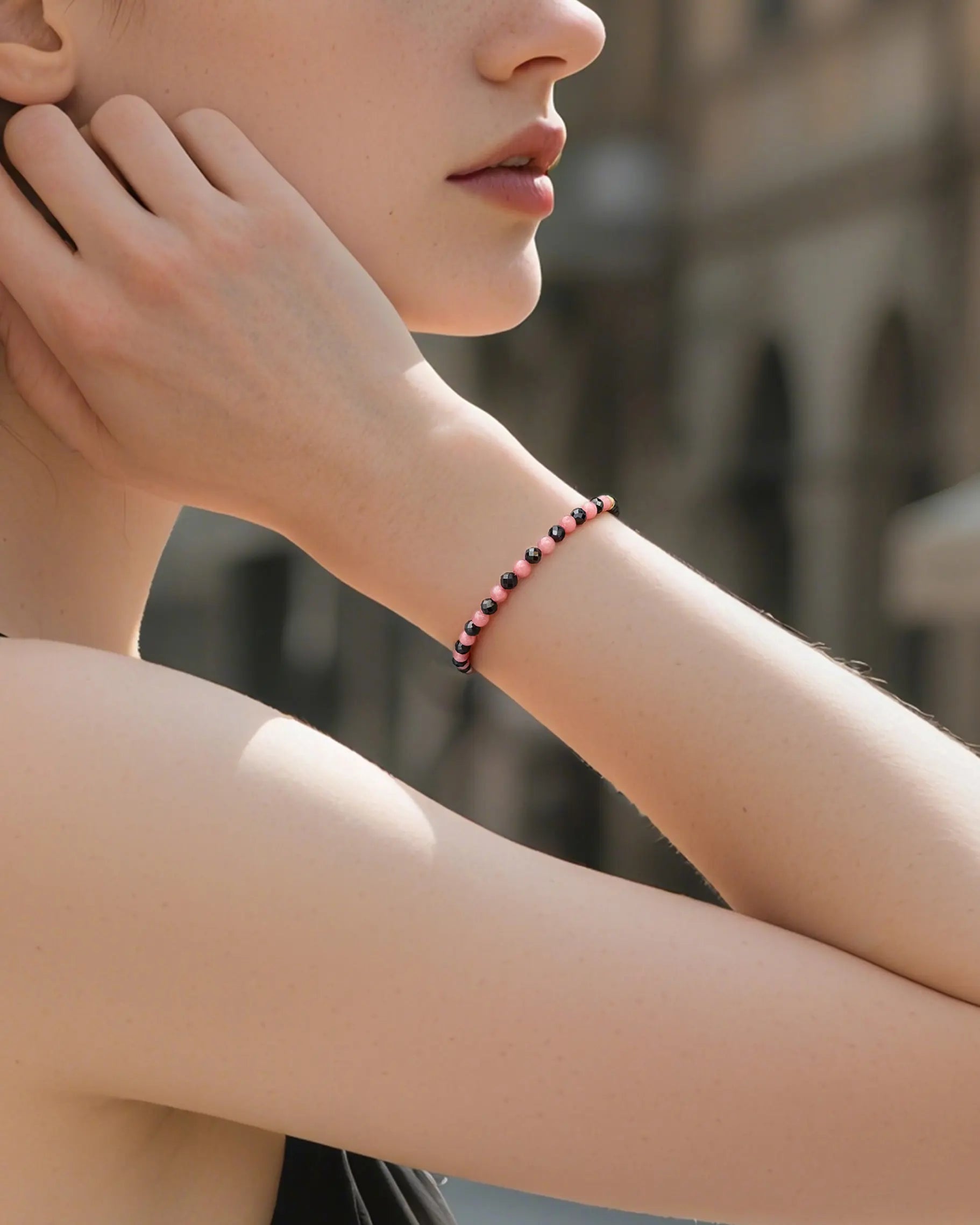 black tourmaline rhodochrosite beaded bracelet on the model