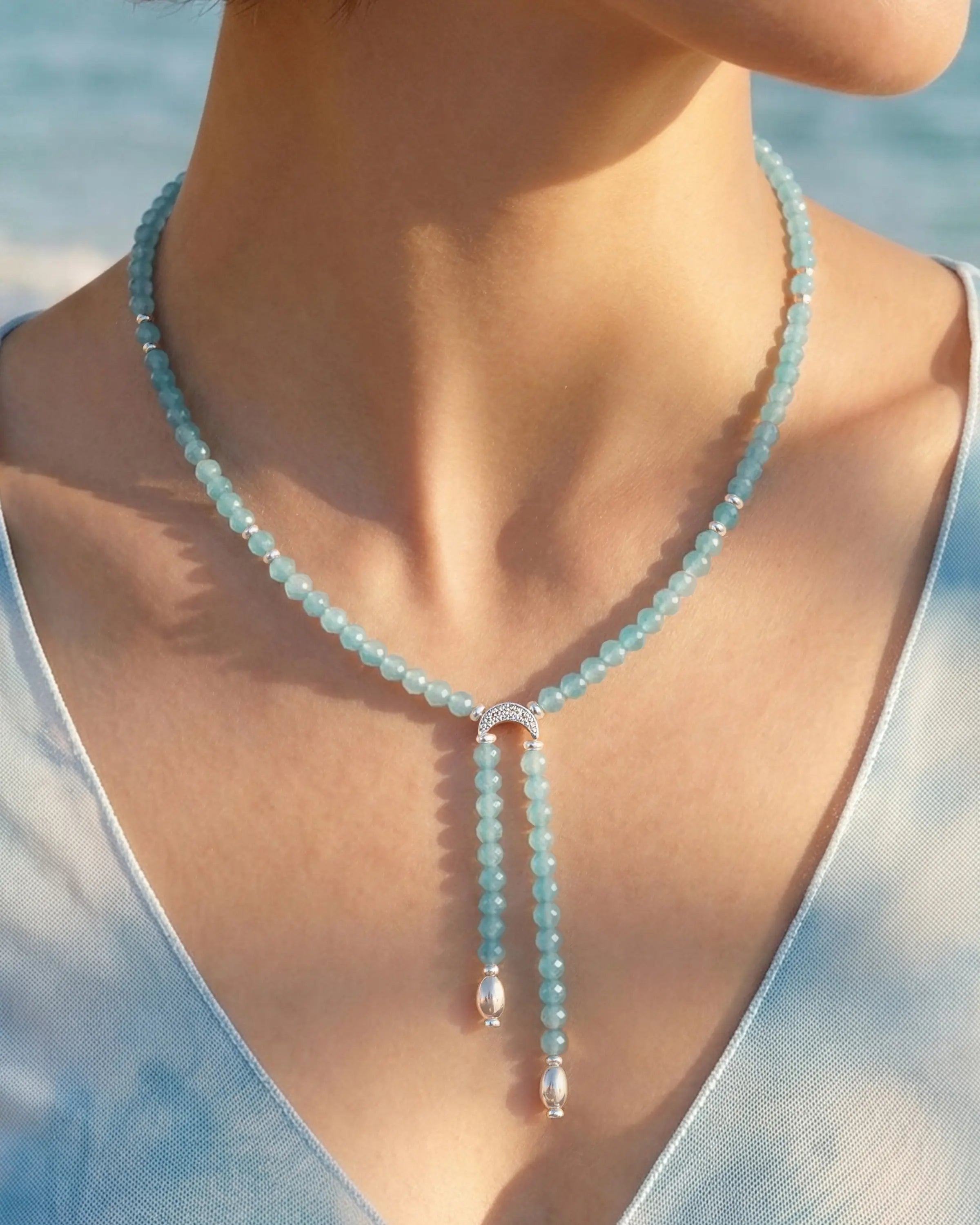 Close-up of Faceted Amazonite Double Drop Silver Necklace on neck