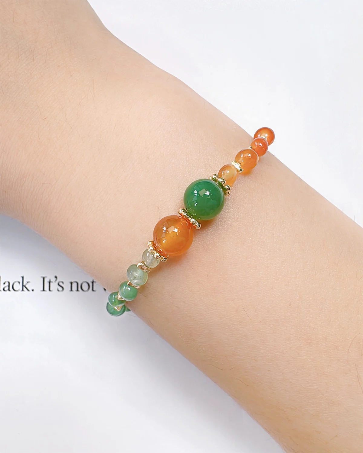 green agate and red agate irregular beaded bracelet on the model – May & July Birthstone Jewelry