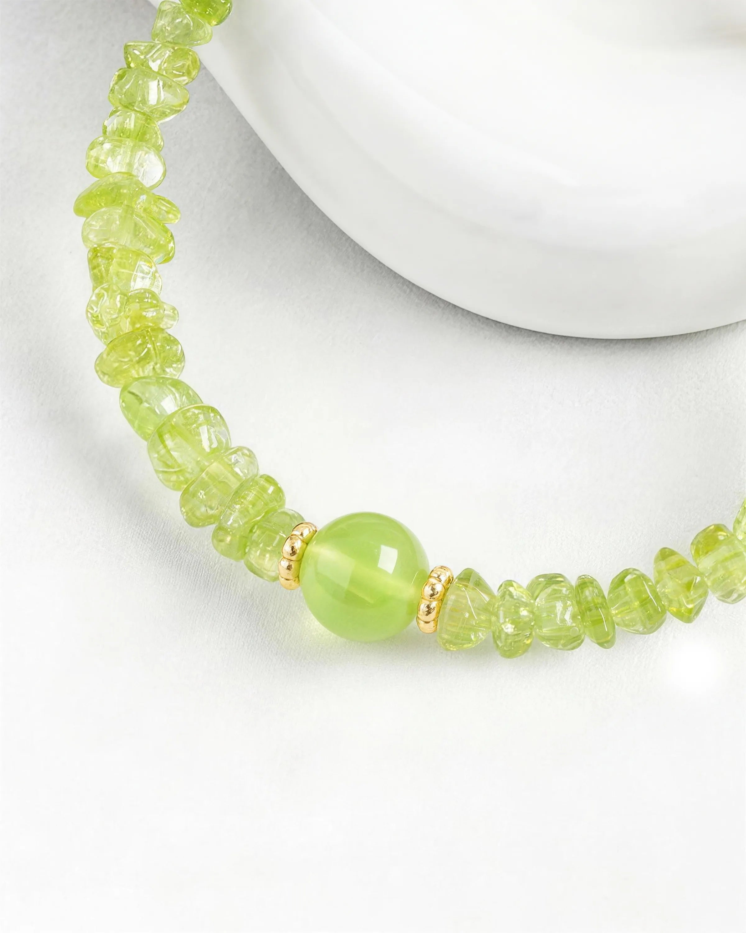Peridot bead detail of Gold Freeform Chips Focal Bracelet
