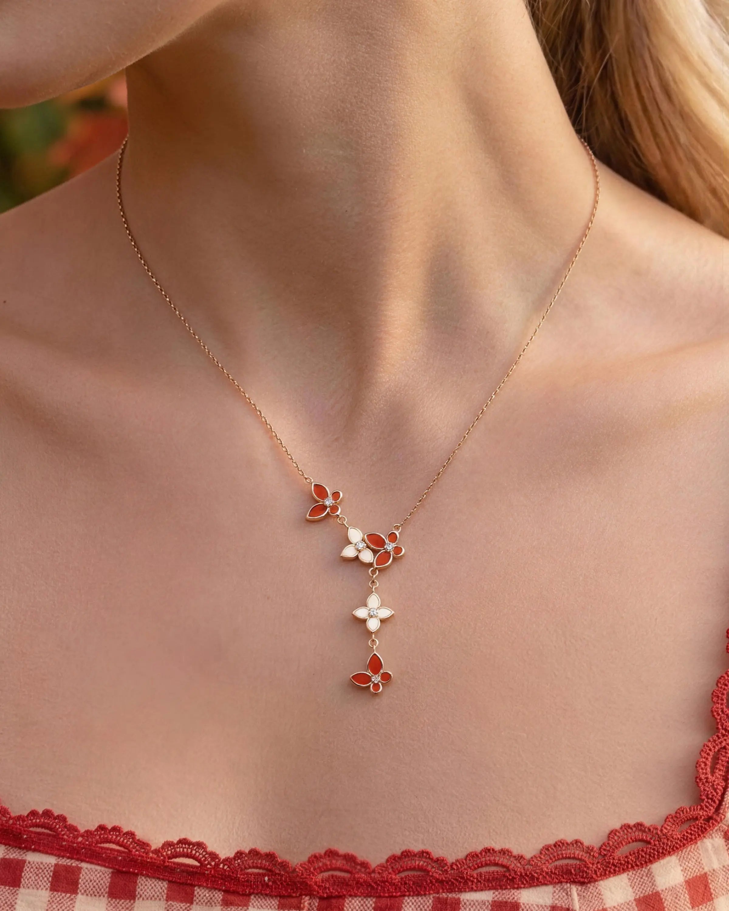 Close-up of Red Agate 18K Gold Plated Butterfly Necklace on neck