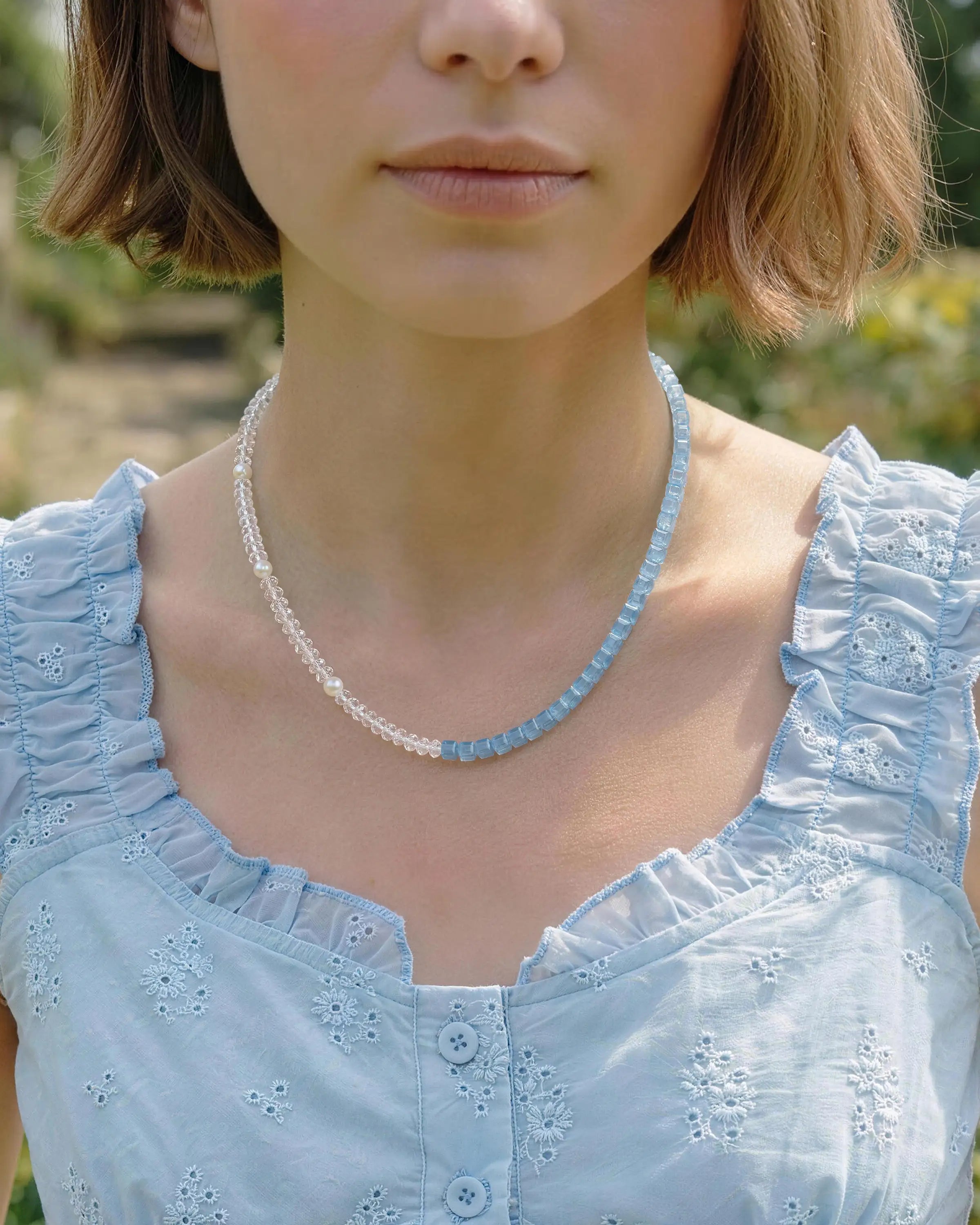 aquamarine initial beaded necklace on the model