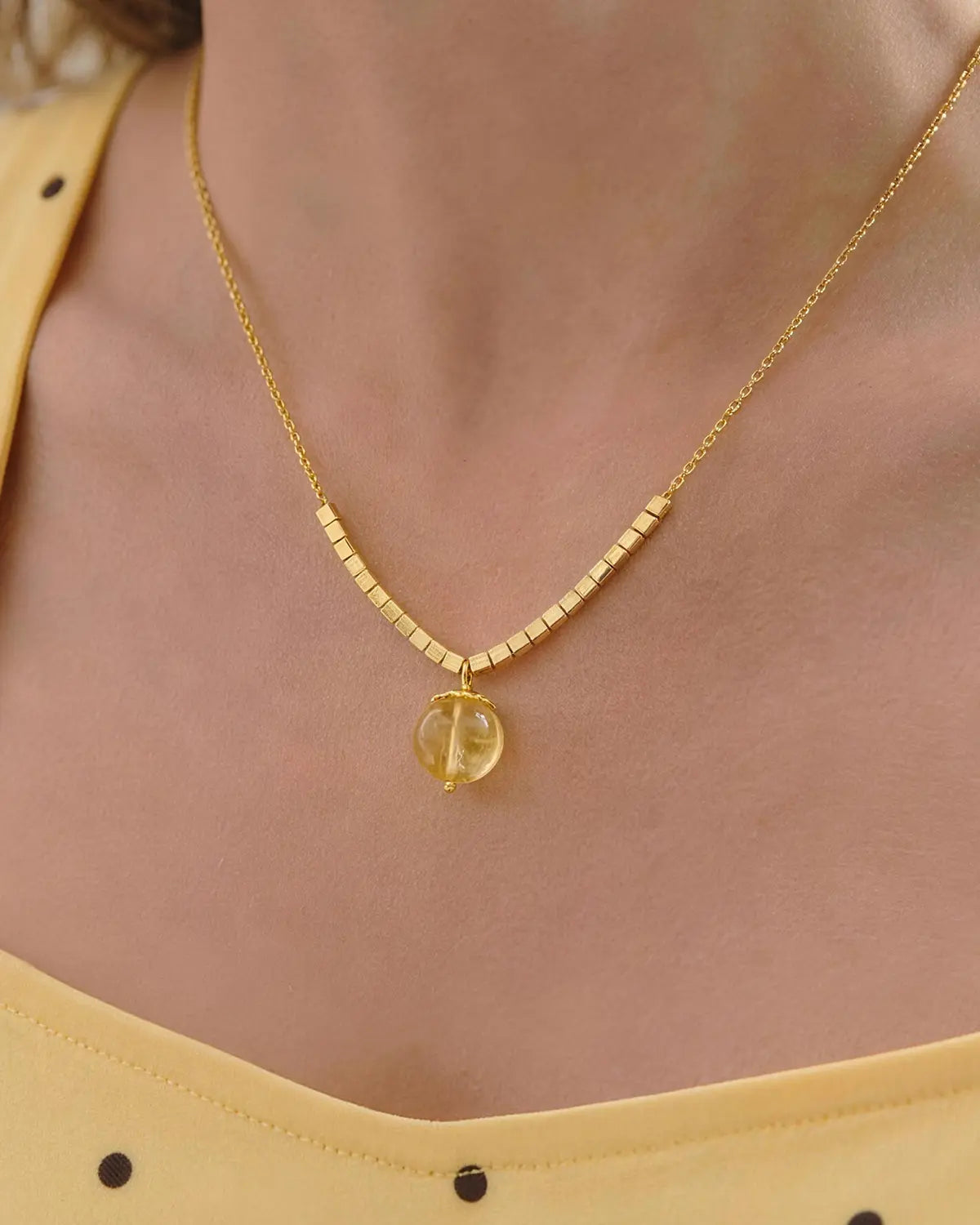 model wearing citrine cube beaded necklace