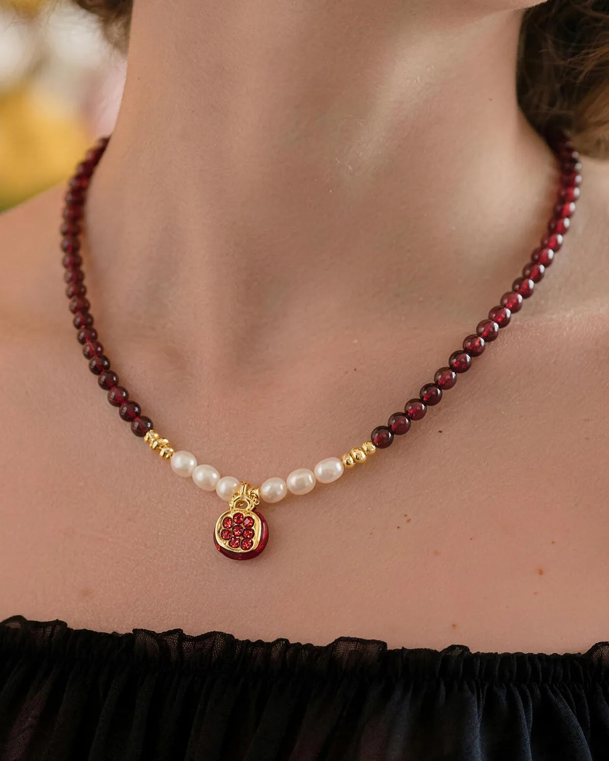 garnet and pearl beaded necklace on the model