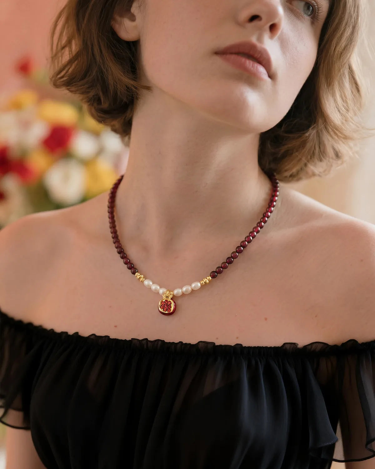 garnet and pear beaded necklace with garnet pendant on the model