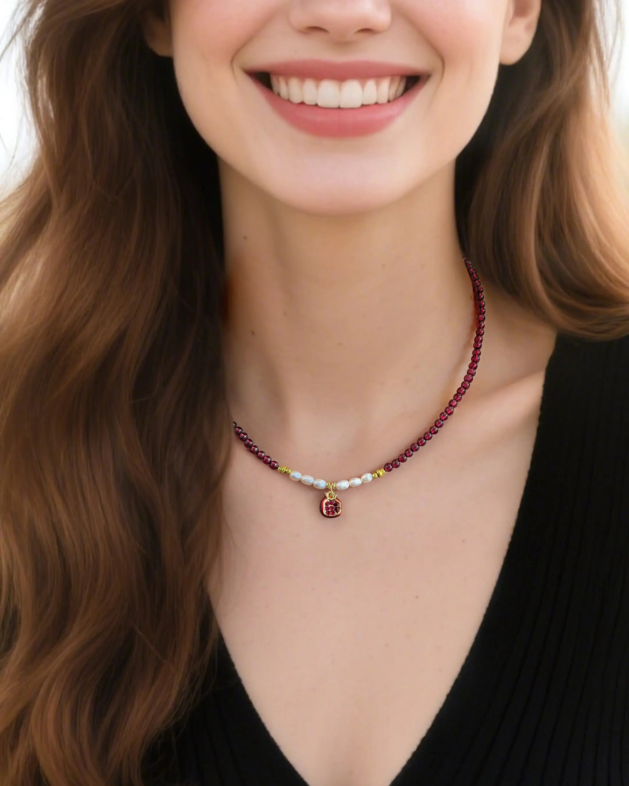 garnet and pear beaded necklace with garnet pendant on the model