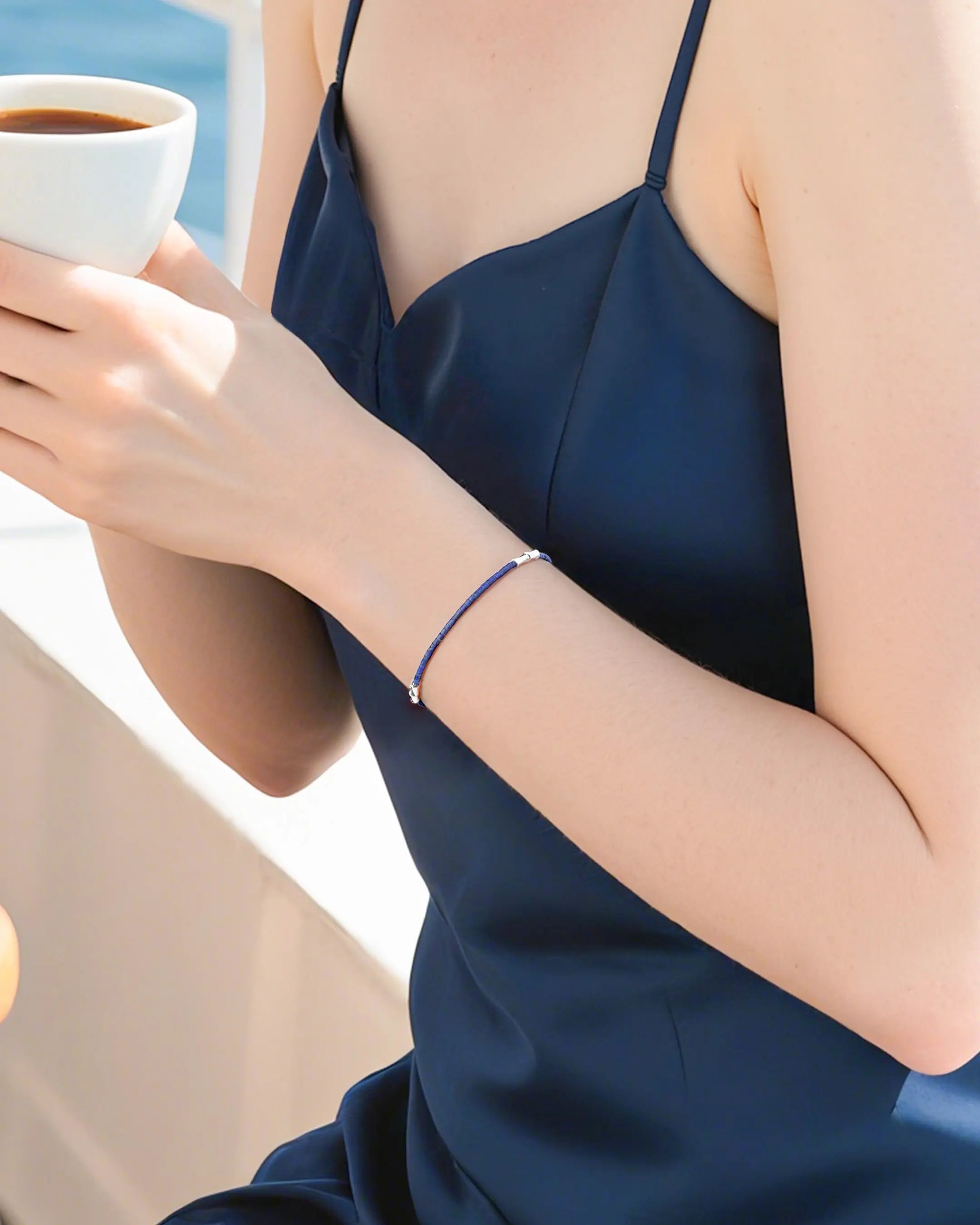 model wearing gold lapis lazuli beaded bracelet | september birthstone