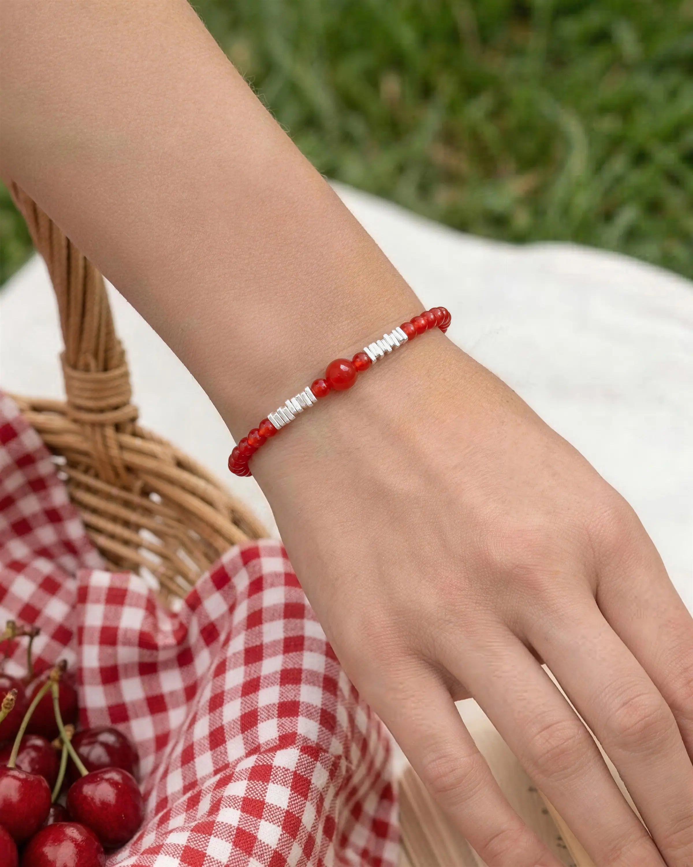 red agate beaded bracelet worn by model