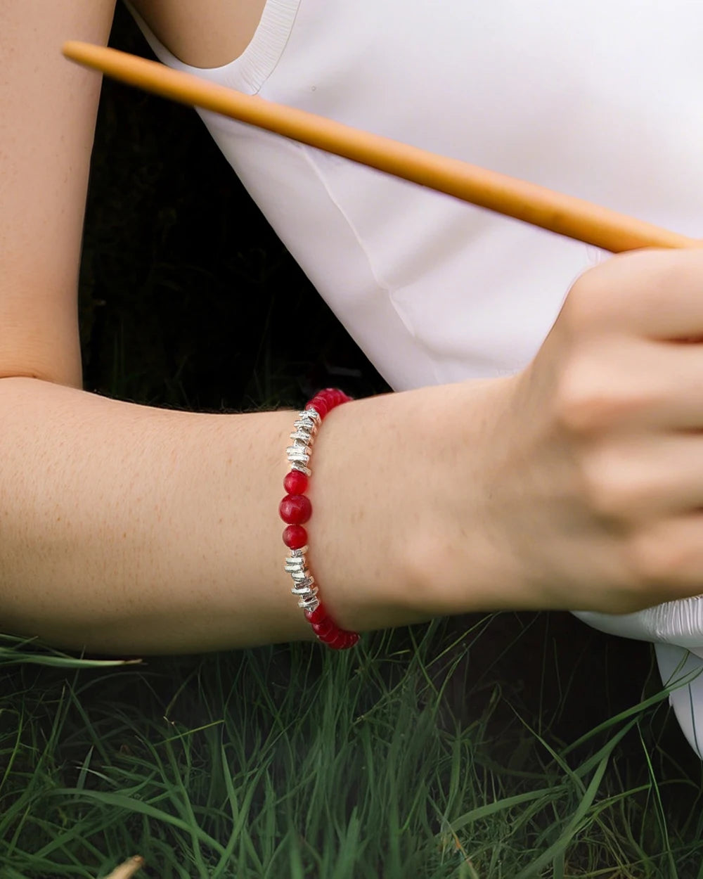 model wearing red agate beaded bracelet