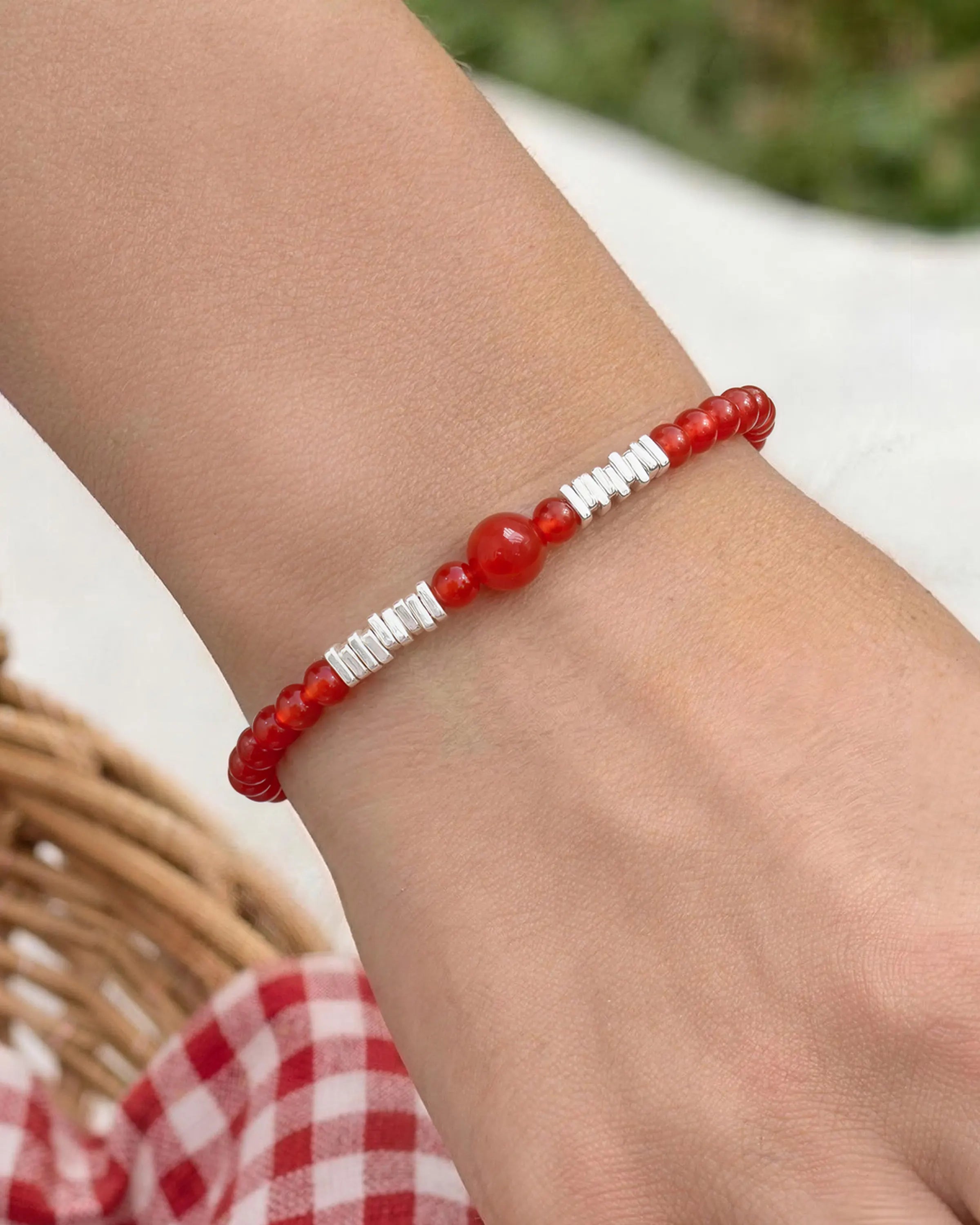 model wearing red agate beaded bracelet