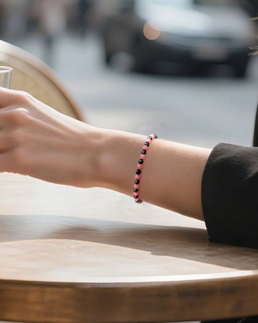 black tourmaline rhodochrosite beaded bracelet on the model