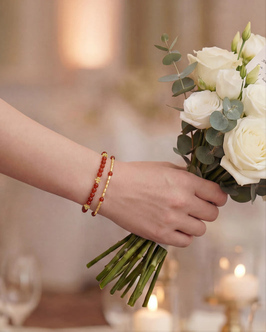 red agate gold floral pre-layered bracelet on the model's wrist